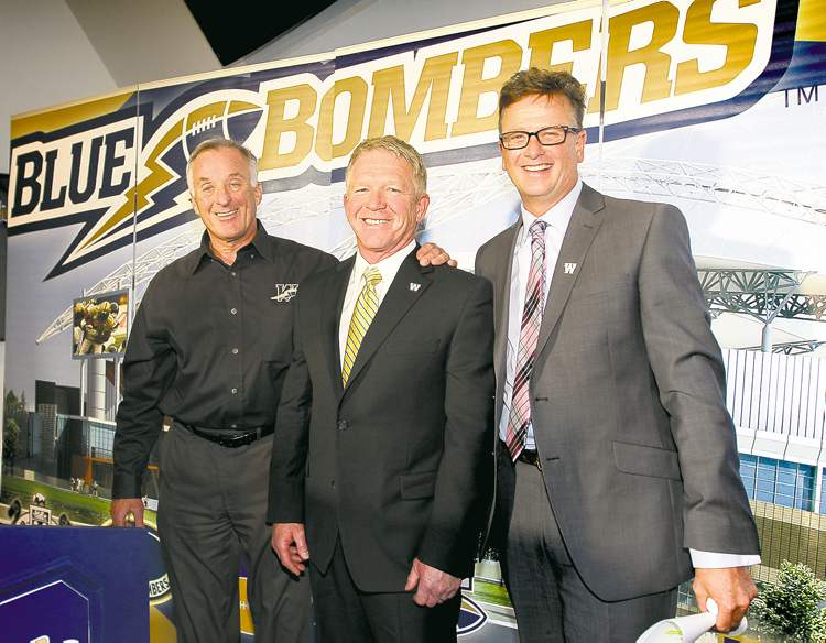 RUTH BONNEVILLE / WINNIPEG FREE PRESS archives
Blue Bombers CEO Garth Buchko (right) is going out on a long, skinny limb by retaining GM Joe Mack (left), who will keep Tim Burke as his head coach.