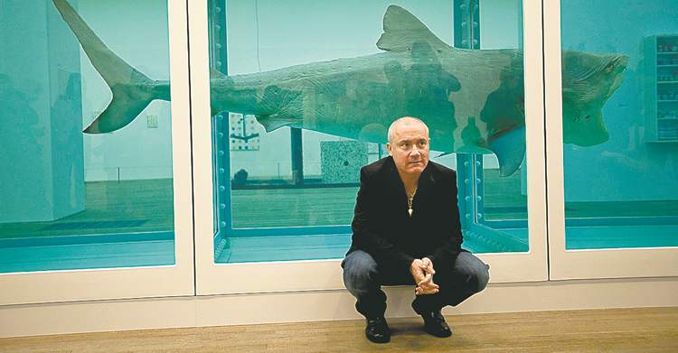THE ASSOCIATED PRESS
Damien Hirst beside his 1991 piece -- a tiger shark peserved in formaldehyde.)