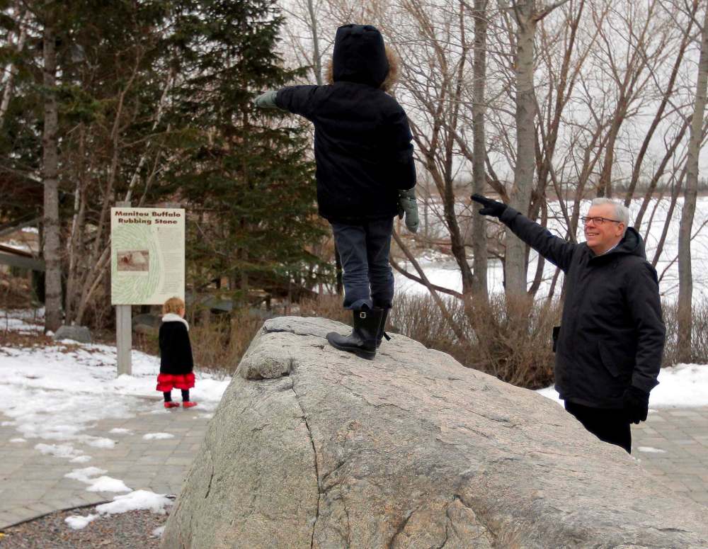 BORIS MINKEVICH / WINNIPEG FREE PRESS
NDP Leader Greg Selinger, right, plays 'explorer' with Adam and his sister, Violet Stewart-Boulay, left.