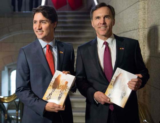 Justin Tang/ The Canadian PressPrime Minister Justin Trudeau, left, poses with Minister of Finance Bill Morneau as he arrives to table the budget on Parliament Hill, Tuesday, March 22, 2016 in Ottawa.