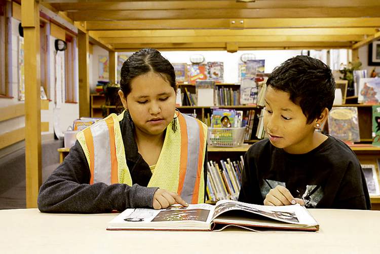 Jamie Bignell, in her �peer helpers� vest, likes to help younger students. �If they�re alone, we�ll talk to them.�