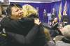 CP
Jonathan Hayward / The Canadian PressWomen hug as commissioner Wally Oppal (rear) delivers his report Monday.