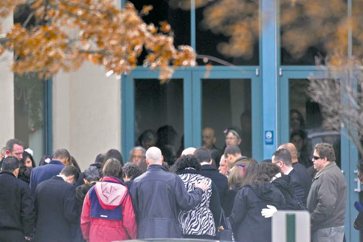 Brad Horrigan / Hartford Courant
Mourners gather in a circle of prayer around Ana Grace Marquez-Greene's casket Saturday before entering The First Cathedral in Bloomfield, Conn.