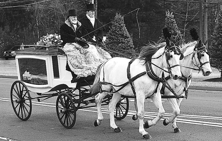 Hartford Courant
Ana's tiny, white casket was on heartbreaking display as it was carried to her