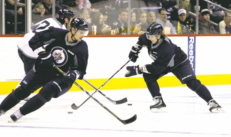 MIKE DEAL / WINNIPEG FREE PRESS
The Jets put on a show for about 5,000 fans at the first official training camp day of 2013 Sunday at the MTS Centre.