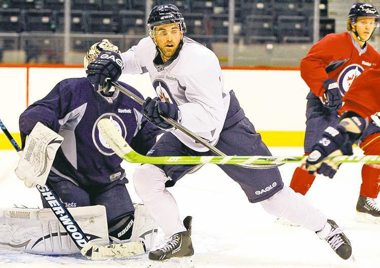 KEN GIGLIOTTI / WINNIPEG FREE PRESS
Andrew Ladd was back at practice one day after his wife Brandy gave birth.