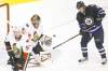 CP
John Woods / THE CANADIAN PRESS 
Winnipeg Jets forward Bryan Little watches as Dustin Byfuglien's shot flies past Ottawa Senators goaltender Craig Anderson during first-period action at the Jets� home opener Saturday.