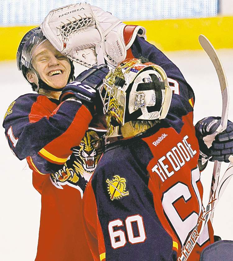Tribune Media MCT
Joe Rimkus Jr. / Miami Herald / MCT
Florida Panthers goalie Jose Theodore gives teammate Jonathan Huberdeau a friendly mugging following a 5-1 victory over the Carolina Hurricanes.