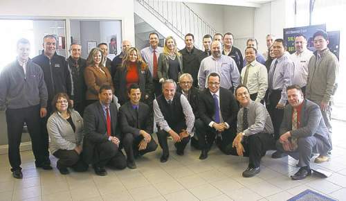 Vickar Chev president Larry Vickar (front row, centre left) and dealer principal Sam Vickar (front row, centre right) and the dealership’s sales team.