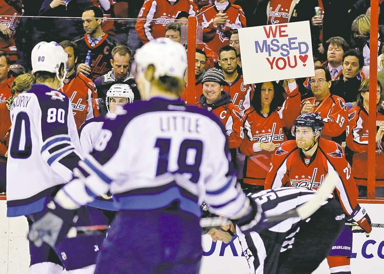 CP
Alex Brandon / the associated press
Fans have flocked back to NHL rinks, including another sellout crowd in Washington Tuesday night for the Caps and the Jets.