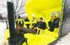 Ruth Bonneville / Winnipeg Free Press 
Landscape architect Liz Wreford-Taylor (front) and her Hygge House co-creators relax Thursday in their brilliant-yellow warming hut on the river. The local design took first place in this year's competition.