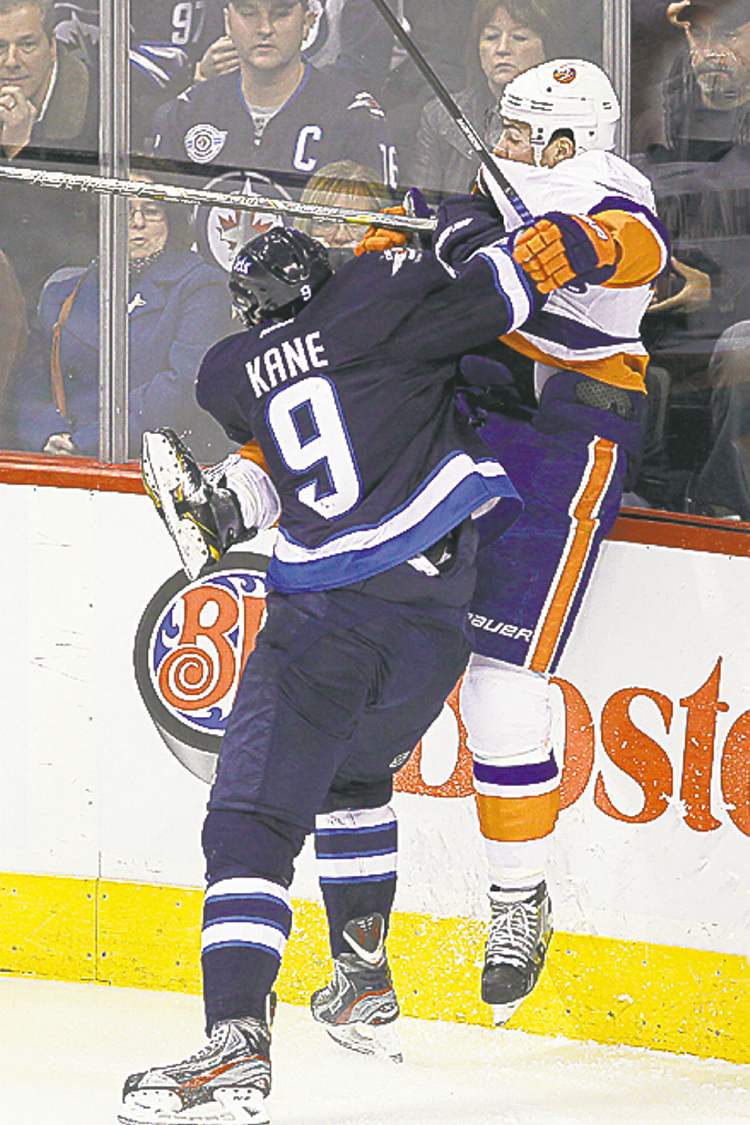 WINNIPEG FREE PRESS
John Woods / WINNIPEG FREE PRESS
Evander Kane rams into Travis Hamonic during the first period.