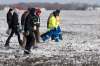JOHN WOODS / THE CANADIAN PRESS
Volunteers search through a farmers' field hoping to find two-year-old Chase Martens near Austin, Man., on Friday. An overnight snowfall is making the search, a race against time in locating the missing boy, even more difficult.