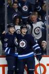 John Woods / The Canadian Press
Winnipeg Jets Adam Lowry (left) and Jacob Trouba celebrate Lowry’s goal against the Los Angeles Kings Thursday.