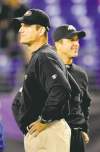 Nick Wass / The Associated Press archives
San Fran head coach Jim Harbaugh (foreground) went head to head with his brother, Ravens boss John Harbaugh, and lost on Nov. 24, 2011. Who will win this time?