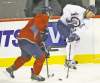 photos by trevor hagan / winnipeg free press
Jets defenceman Mark Stuart  pursues Olli Jokinen during practice Sunday at the MTS Centre.