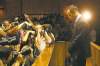 CP
Photographers take photos of athlete Oscar Pistorius at his bail hearing Friday.