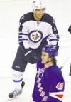 Adam Hunger / reuters
Evander Kane celebrates his second-period goal Tuesday night.