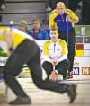 REUTERS
Alberta's Kevin Martin (rear) and Manitoba's Jeff Stoughton were locked in a heavyweight battle on the opening day of the Brier in Edmonton Saturday.