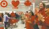 CP
Dave Chidley / The Canadian PressEmployees welcome the first shoppers who lined up for the opening of the new Target store in Guelph, Ont., Tuesday.