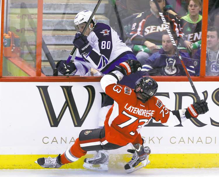 fred chartrand / the canadian press
Ottawa Senators' Guillaume Latendresse (73) and Winnipeg Jets Nik Antropov bang into the boards Sunday afternoon in Ottawa.