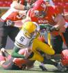 Postmedia Calgary Herald
Lorraine Hjalte / postmedia news archivesCalgary Dinosaurs D-lineman Linden Gaydosh is about to squash an Alberta QB. Gaydosh might look good in Blue and Gold.