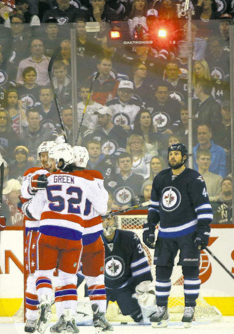 JOE BRYKSA / WINNIPEG FREE PRESS
Winnipeg Jets defenceman Zach Bogosian has that here-we-go-again look as the Caps' Jay Beagle scores to make it 3-0 and chase Jets goalie Ondrej Pavelec from the net.