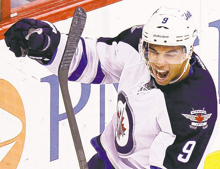 Ellen Ozier / REUTERS
Winnipeg Jets' Evander Kane reacts after scoring a goal against the Carolina Hurricanes during the third period.