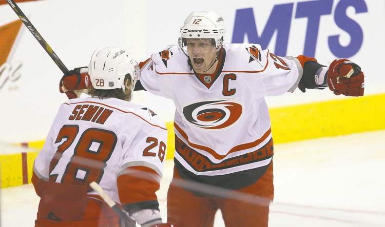 TREVOR HAGAN / WINNIPEG FREE PRESS
Carolina forwards Alexander Semin and Eric Stall celebrate after combining on Semin�s goal at 1:06 of the first period.