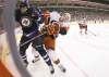 CP
John Woods / the canadian press
Winnipeg�s Antti Miettinen and Carolina�s Brett Bellemore go hard into the corner during the second period.