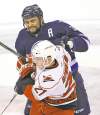 TREVOR HAGAN/FREE PRESS ARCHIVES
Dustin Byfuglien, tussling with 'Canes' Drayson Bowman Saturday, isn't worried about a trade.