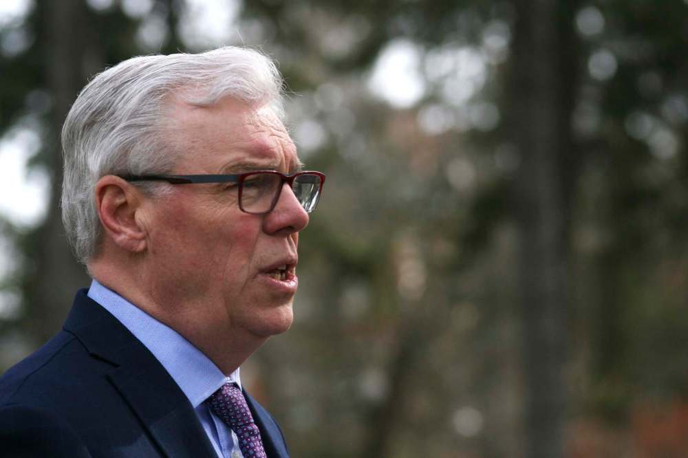 Matt Goerzen/Brandon Sun
Manitoba NDP Premier Greg Selinger stands in front of the Parkland Building at the Assiniboine Community College North Hill campus on Tuesday.