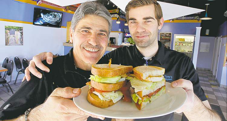 BORIS MINKEVICH / WINNIPEG FREE PRESS
Gus & Tony's Tony Vailas (left) and his son Gus show off their version of the clubhouse.