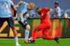 New York City FC's Anton Tinnerholm, center, and Toronto FC's Ashtone Morgan, right, fights for control of the ball during the second half of an MLS soccer match Wednesday, Sept. 11, 2019, in New York. The game ended in a 1-1 draw. (AP Photo/Frank Franklin II)