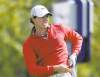 Eric Gay / The Associated Press
It's not as bad as the grimace lets on: Rory McIlroy, reacting to a drive on the first hole, is four shots back.