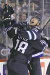 john Woods / The Canadian Press
Winnipeg Jets forwards Blake Wheeler (right) and Bryan Little celebrate Little's goal against the Philadelphia Flyers during the second period Saturday at the MTS Centre. The Jets exploded for four goals in seven minutes in the second period to snap their five-game losing streak with a 4-1 win.