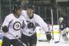trevor hagan / winnipeg free press
Chris Thorburn (left) and James Wright practise their celebration act after they combined on a beauty in a drill at practice Sunday in the MTS Centre.