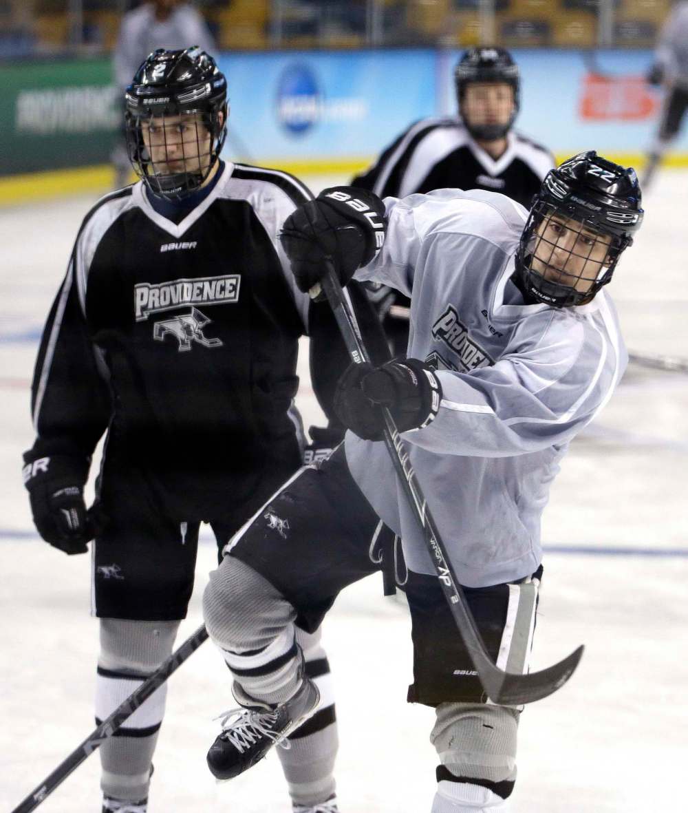 ELISE AMENDOLA / THE ASSOCIATED PRESS
Providence's Brandon Tanev, right, shoots on goal during practice in a 2015 file photo.