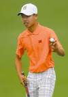 Tribune Media MCT
Tianlang Guan acknowledges the crowd�s applause after making a putt on the second green at Augusta National Golf Club during second round action of the Masters Tournament at Augusta National Golf Club, Friday, April 12, 2013, in Augusta, Georgia. (Jeff Siner/Charlotte Observer/MCT)
