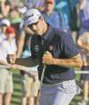 CP
David J. Phillip / the associated pressAdam Scott celebrates after a birdie on the 17th hole during the third round Saturday.