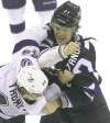JOE BRYKSA / WINNIPEG FREE PRESS
The Jets' Eric Tangradi (right) and the Lightning's Nate Thompson duke it out in the second period at the MTS Centre.