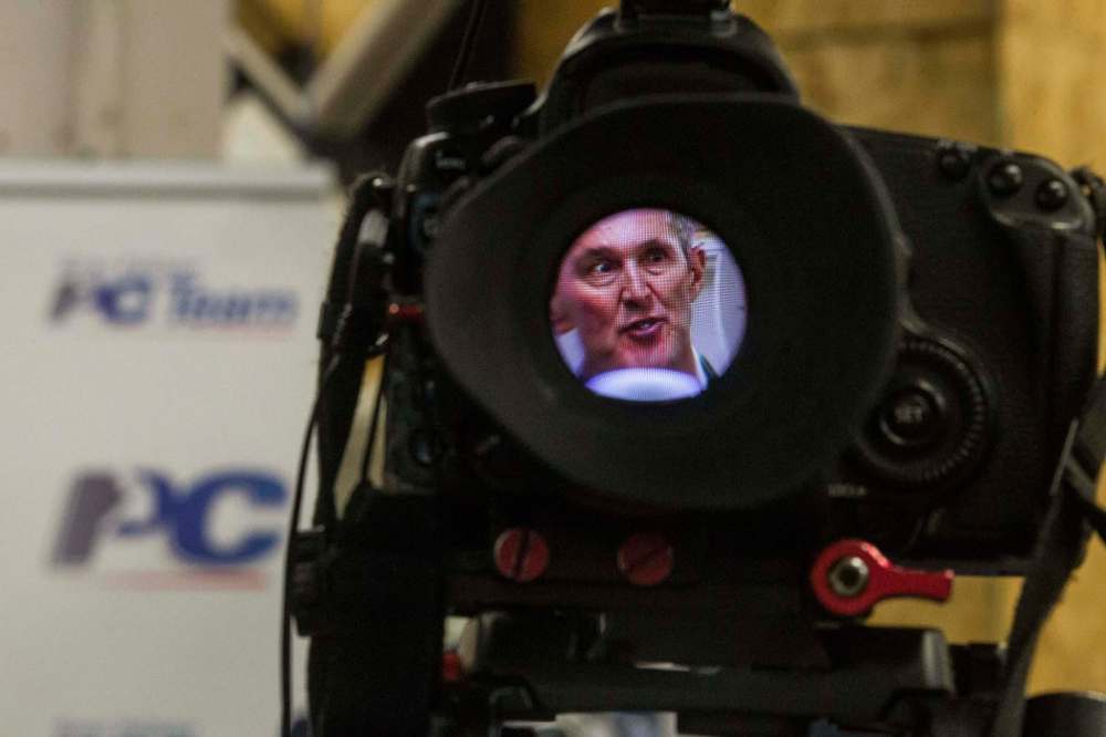 PHOTOS BY MIKE DEAL / WINNIPEG FREE PRESS
Seen through a camera’s eyepiece, PC Leader Brian Pallister outlines his economic plan at AssentWorks