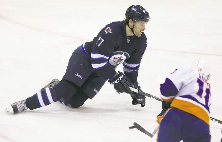 TREVOR HAGAN / WINNIPEG FREE PRESS
Winnipeg�s Eric Tangradi goes down to make one of four blocks in a single shift, this one against New York�s Keith Aucoin.