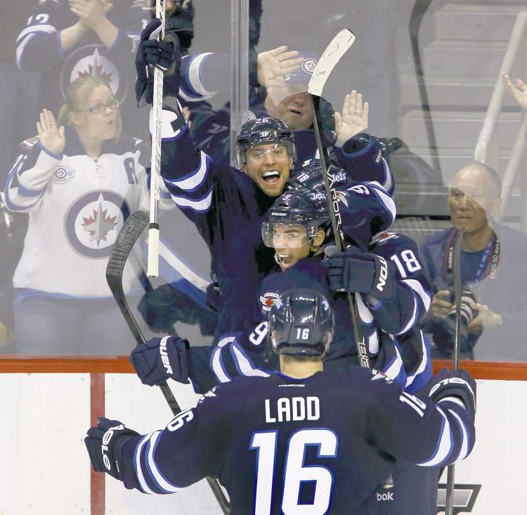 TREVOR HAGAN / WINNIPEG FREE PRESS
There were celebrations on both sides of the glass after Winnipeg�s Bryan Little (18) scored to tie the game 4-4 late in the third period.