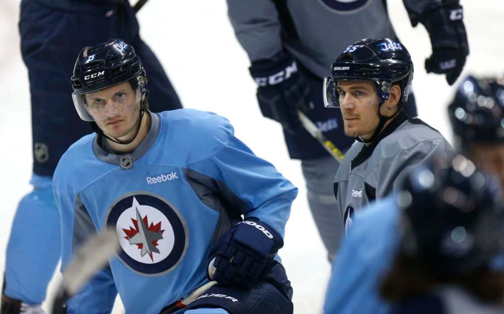 WAYNE GLOWACKI / WINNIPEG FREE PRESS FILES
Winnipeg Jets players #55 Mark Scheifele, right, and #8 Jacob Trouba at the team practice in early March.