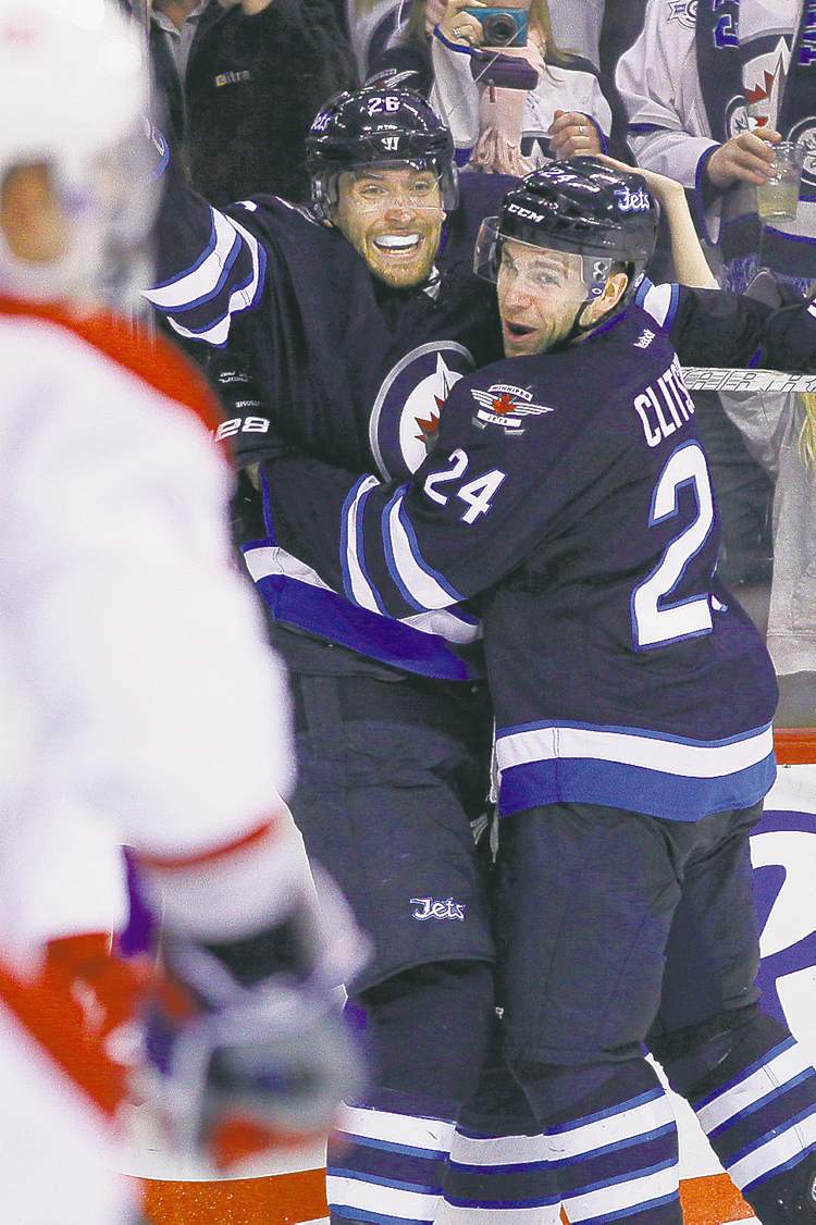 CP
John Woods / the canadian press
Winnipeg�s Blake Wheeler (left) and Grant Clitsome celebrate Wheeler�s second-period goal.