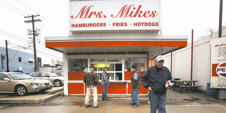 Mrs. Mikes burger stand has been a mainstay on Tache Avenue for decades, but these days it opens without founder Nick Mikos, who worked the grill from 1967 until his death last year.
