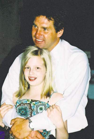 Supplied photo
Hockey commentator Kelly Hrudey embraces his daughter Kaitlin at a family wedding.
