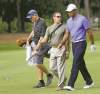CP
Tiger Woods walks with his caddie, Joe LaCava (left), and golfing coach Sean Foley during practice rounds Tuesday for the Players Championship tournament at TPC Sawgrass in Ponte Vedra Beach, Fla.