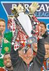 CP
Jon Super / the associated pressSir Alex Ferguson hoists the Premier League trophy for the 13th and last time.
